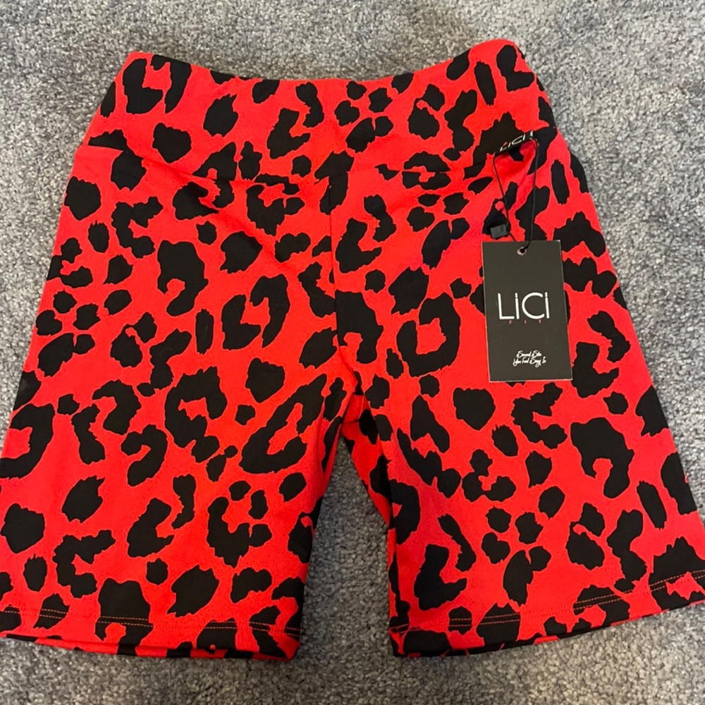 Red print short. Never worn, just fits too small